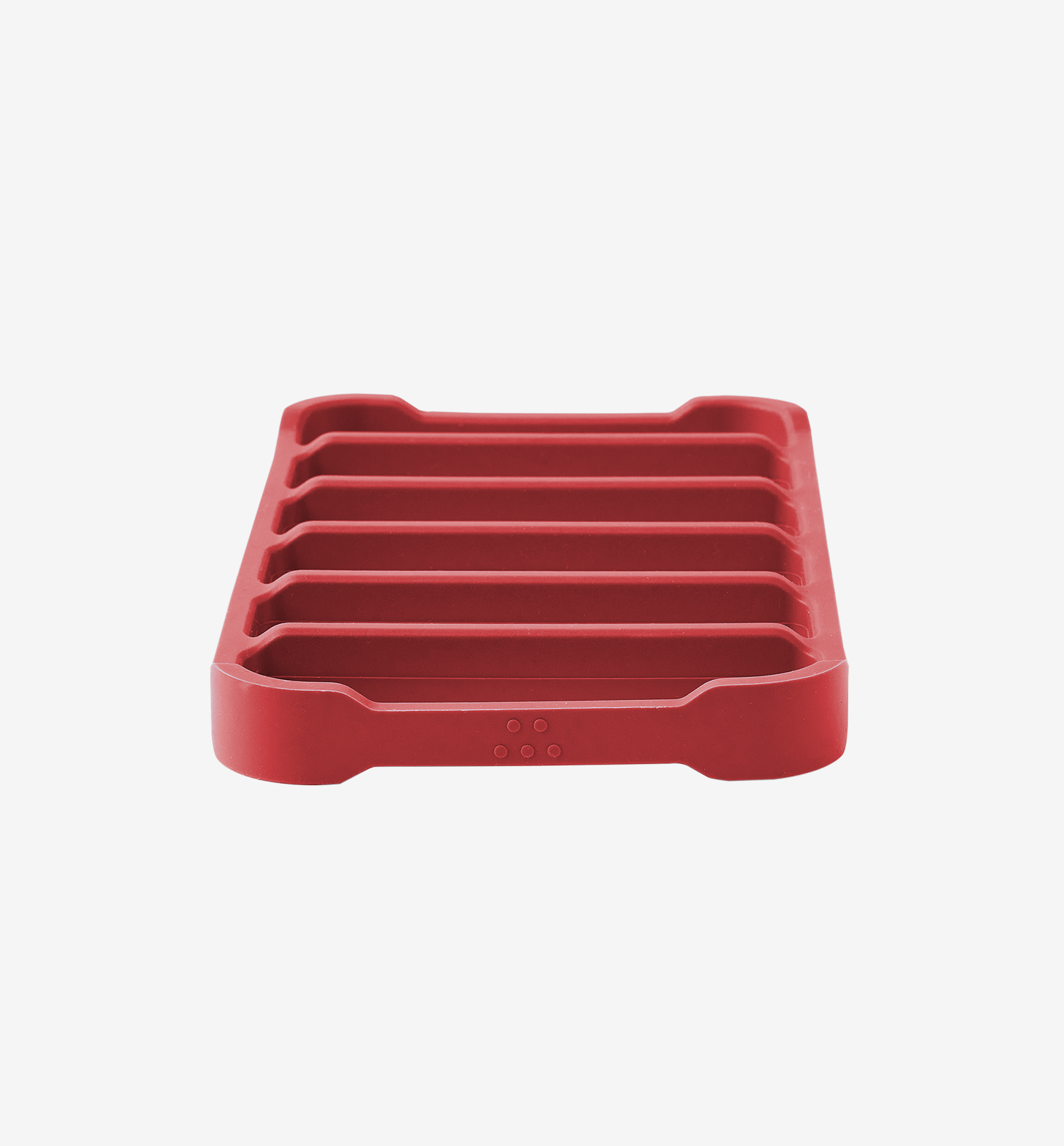 Red silicone trivet with raised ridges for heat protection